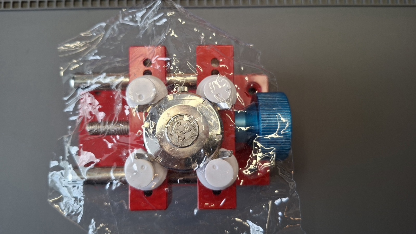Watch in the vise covered with anti-slip film